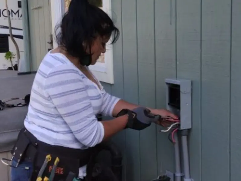 Licensed electrician wiring an exterior subpanel in Winthrop Harbor